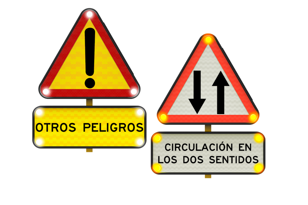 Conjunto de señales triangulares de advertencia con luces, que incluyen símbolo de exclamación y circulación en ambos sentidos, sobre fondo blanco.